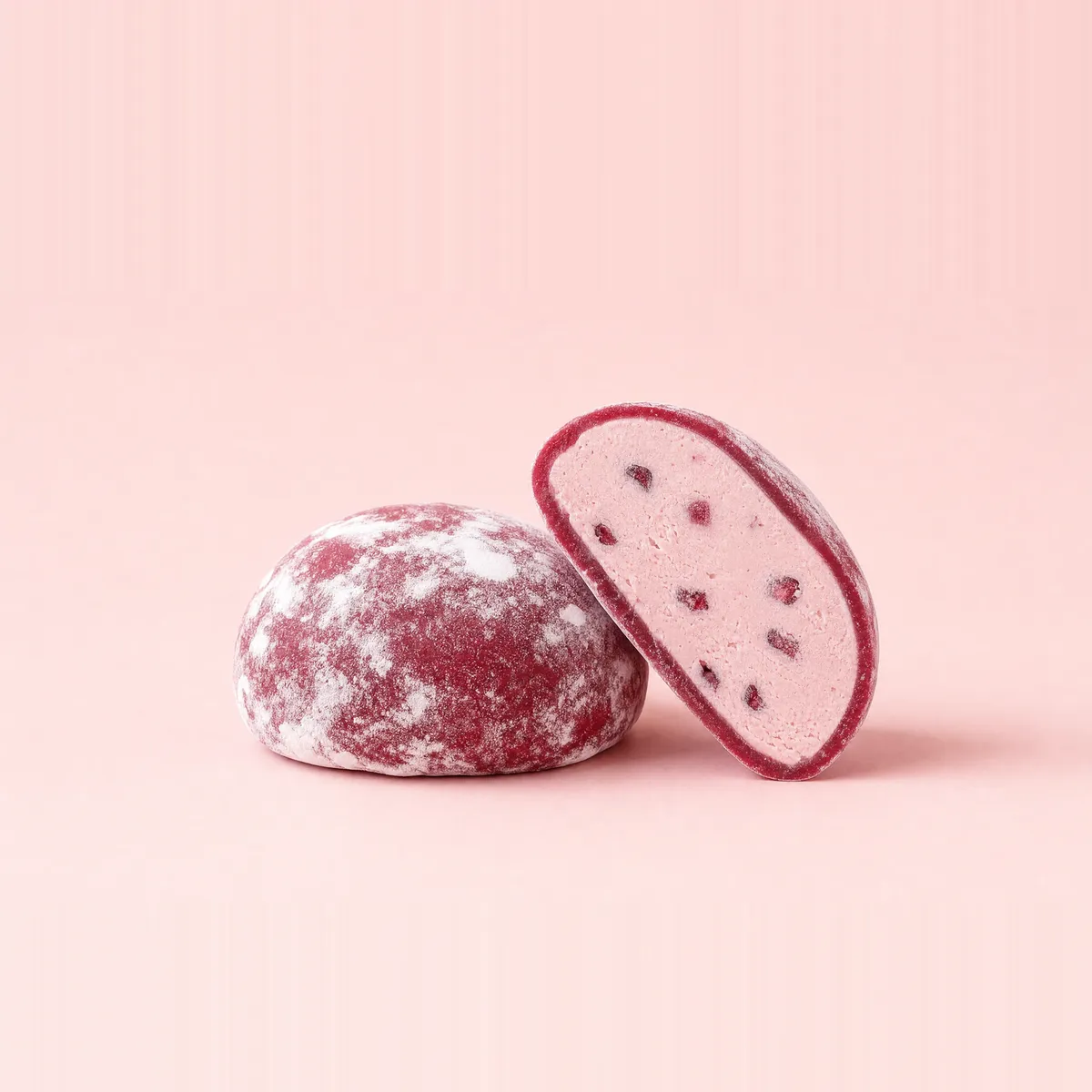 Pomegranate mochi, whole and cut open