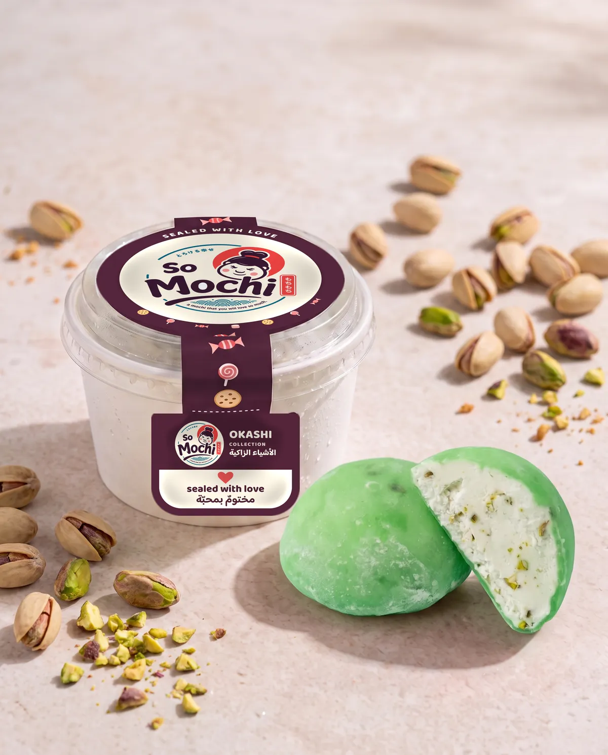 Jumbo Arabic mochi, whole and cut open, beside its sealed So Mochi cup