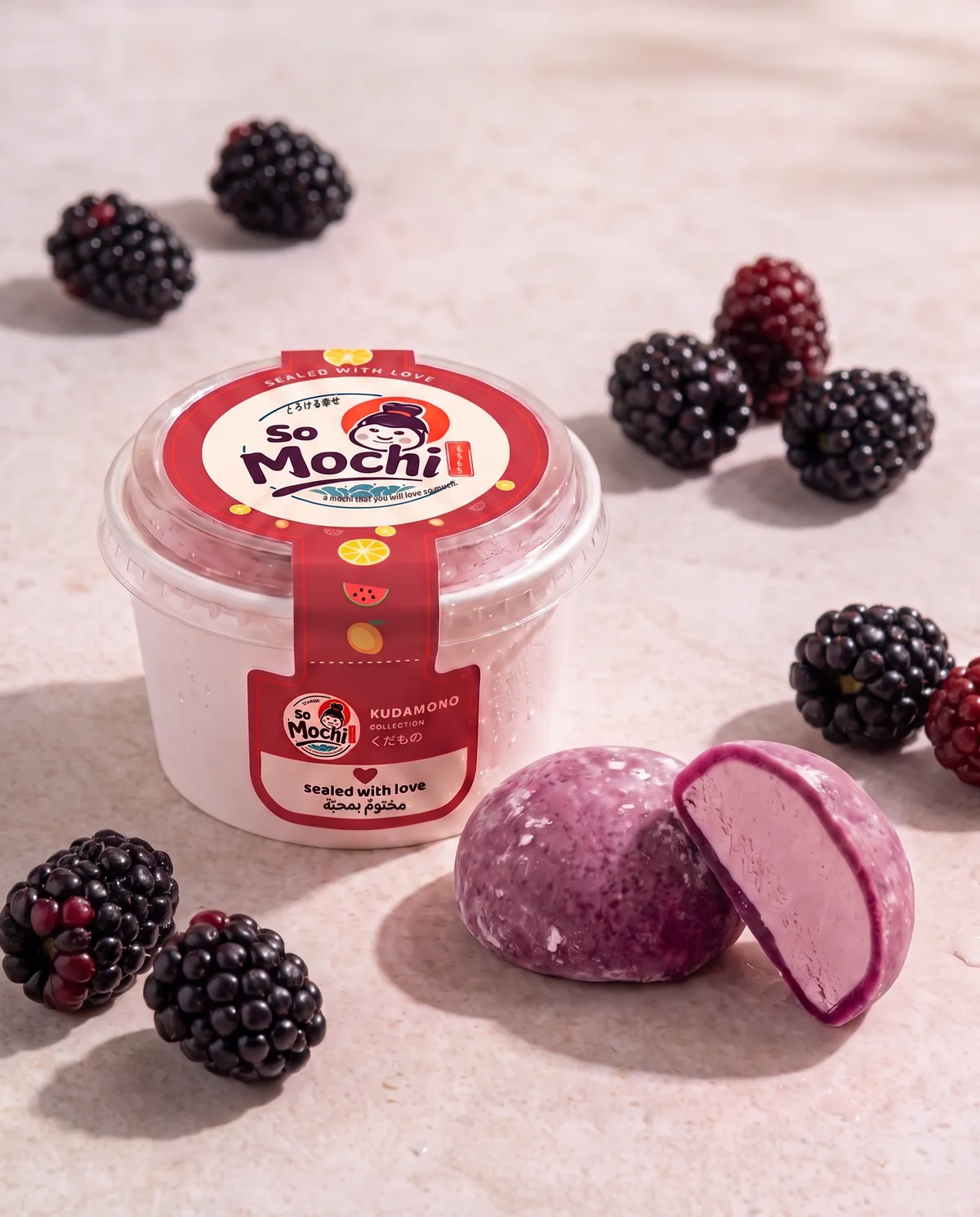 Blackberry jumbo mochi beside its sealed So Mochi cup