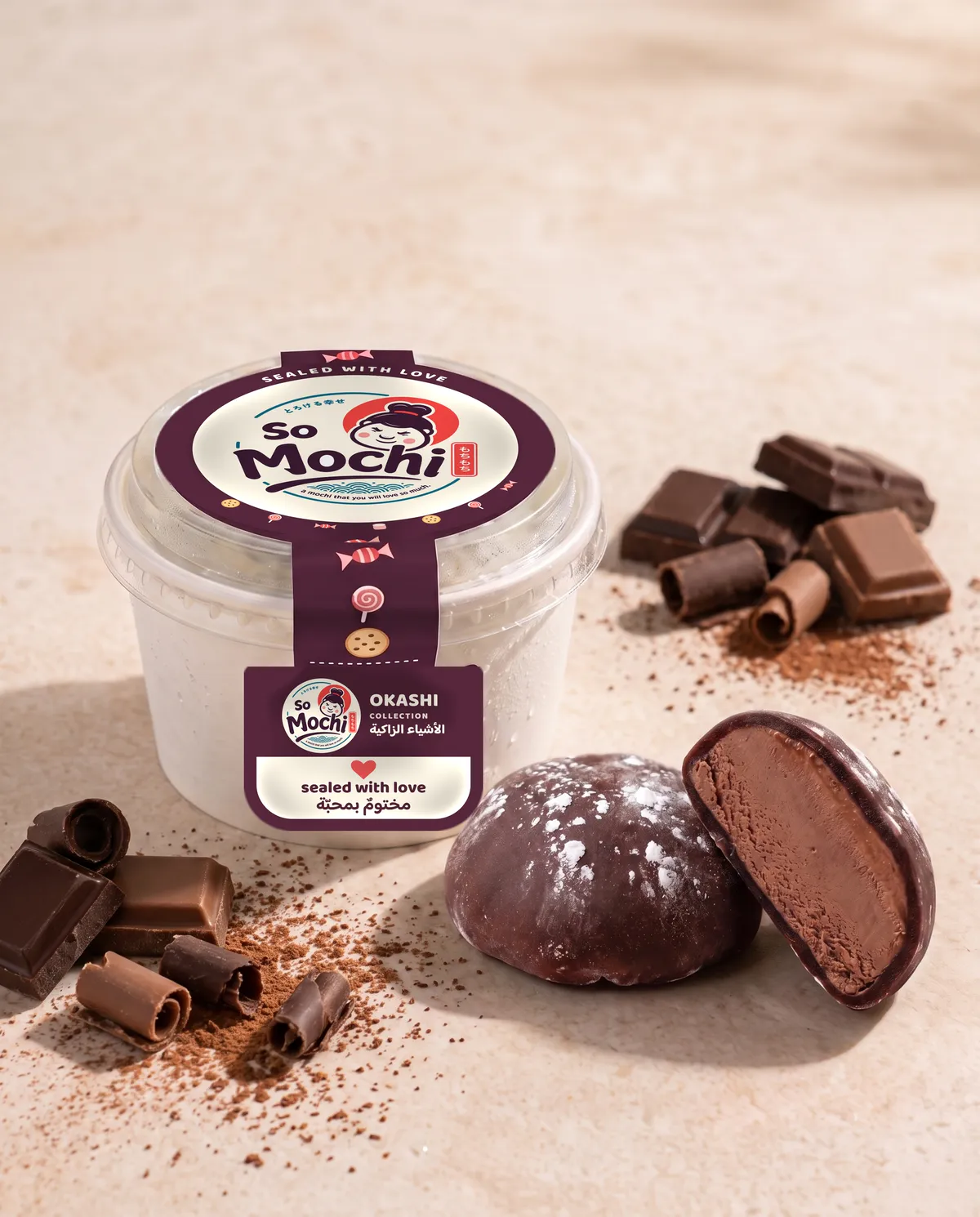 Jumbo Chocolate mochi, whole and cut open, beside its sealed So Mochi cup