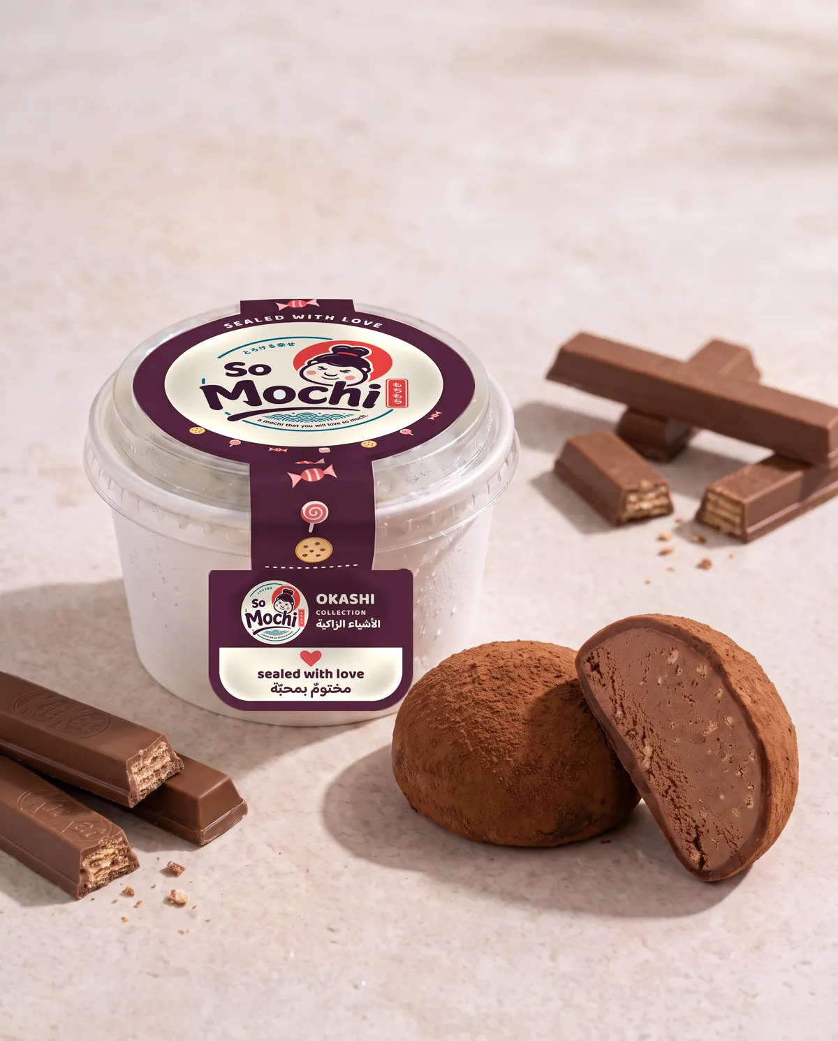 Jumbo KitKat mochi, whole and cut open, beside its sealed So Mochi cup