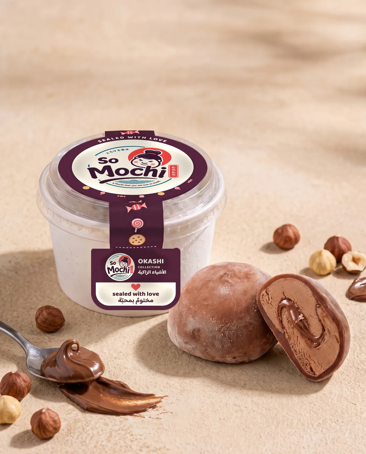 Jumbo Nutella mochi, whole and cut open, beside its sealed So Mochi cup