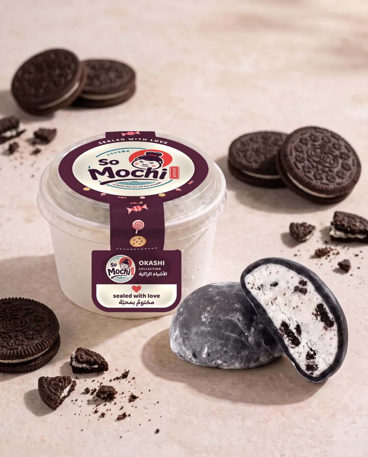 Jumbo Oreo mochi, whole and cut open, beside its sealed So Mochi cup