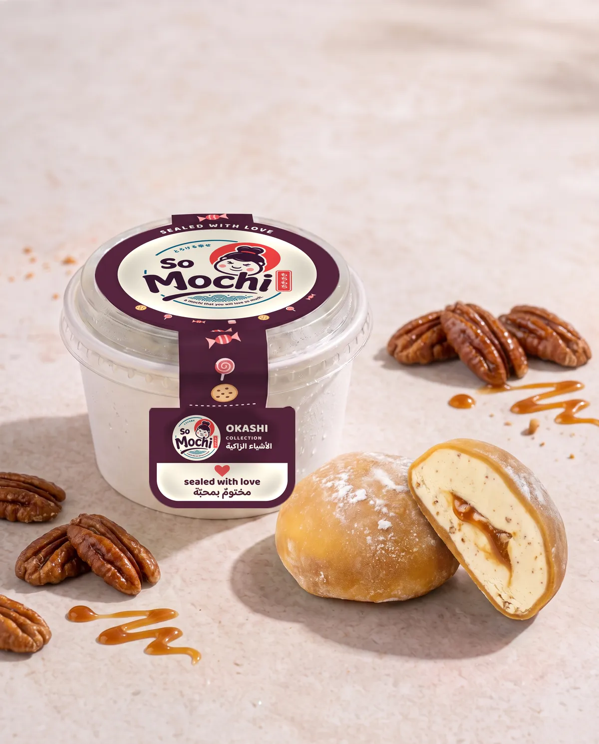Jumbo Praline Pecan mochi, whole and cut open, beside its sealed So Mochi cup