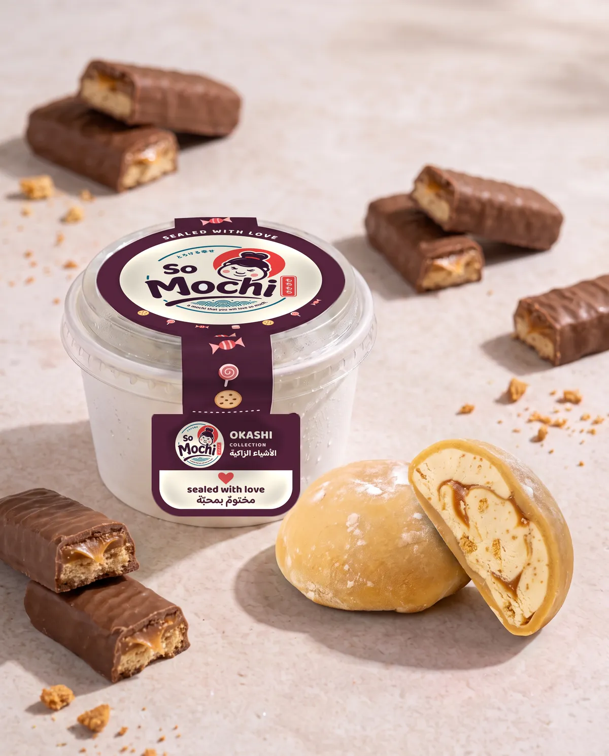 Jumbo Twix mochi, whole and cut open, beside its sealed So Mochi cup