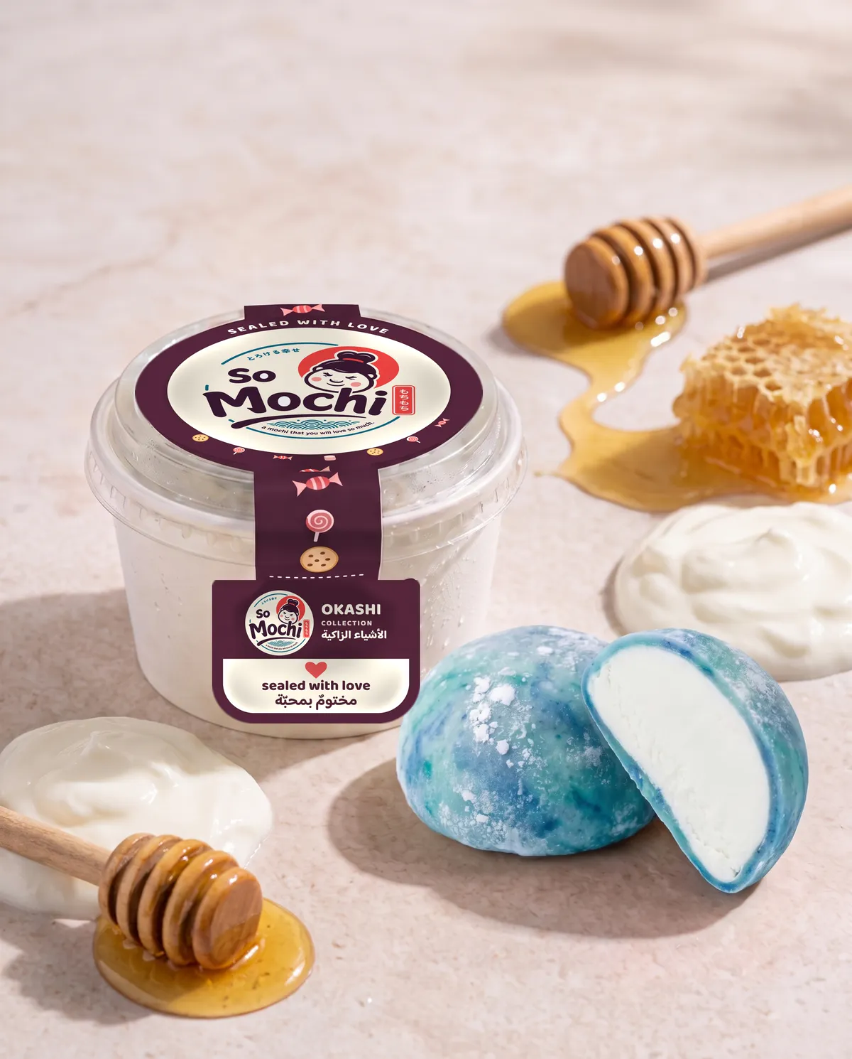 Jumbo Yogurt & Honey mochi, whole and cut open, beside its sealed So Mochi cup